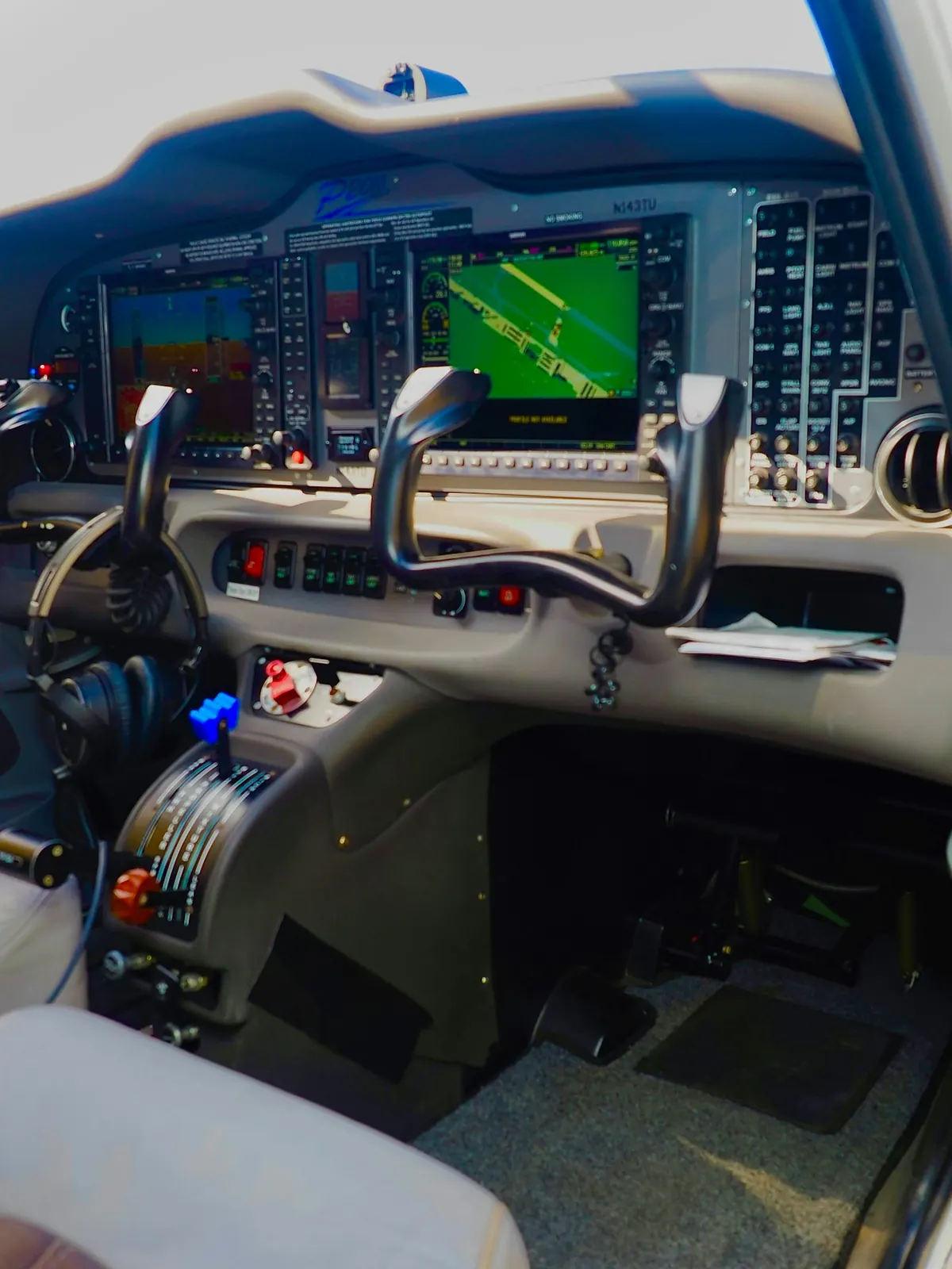 Flight deck with control yokes and glass displays